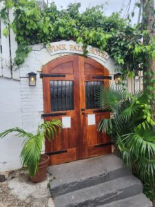 entrance to pink palm hotel